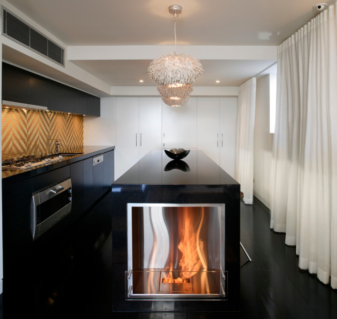 fireplace built into the island in the kitchen