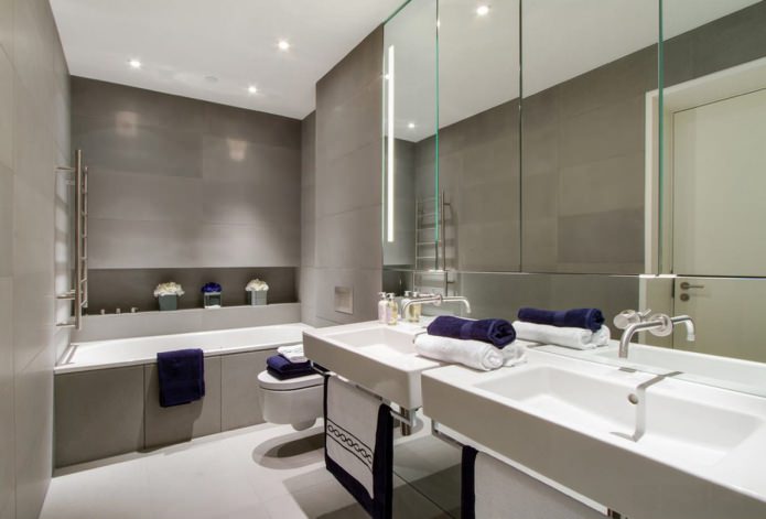 gray tiles in the bathroom combined with white fixtures