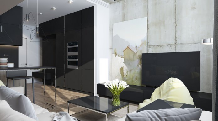 A nappali modern kialakítása a stúdió apartman konyhájával kombinálva
