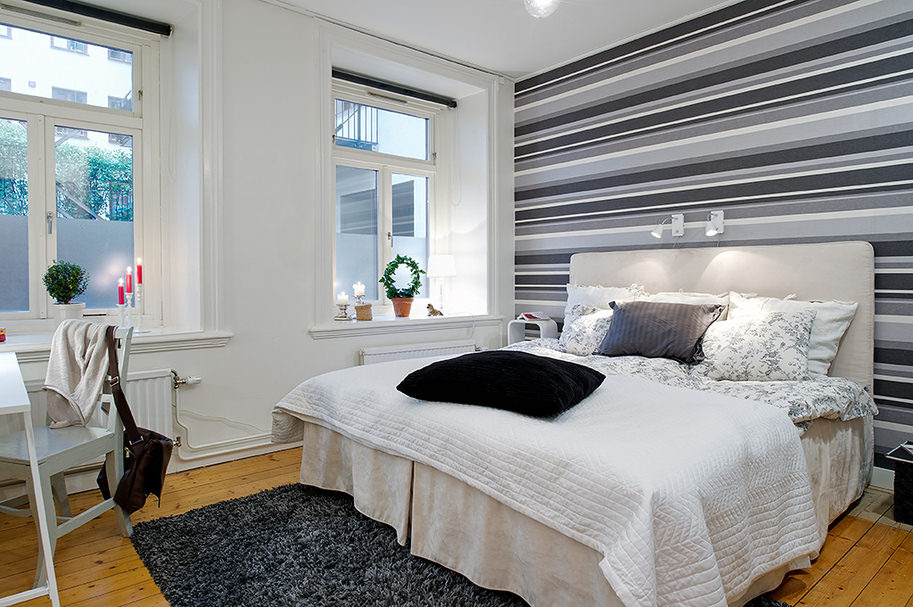 bedroom design with gray striped wallpaper