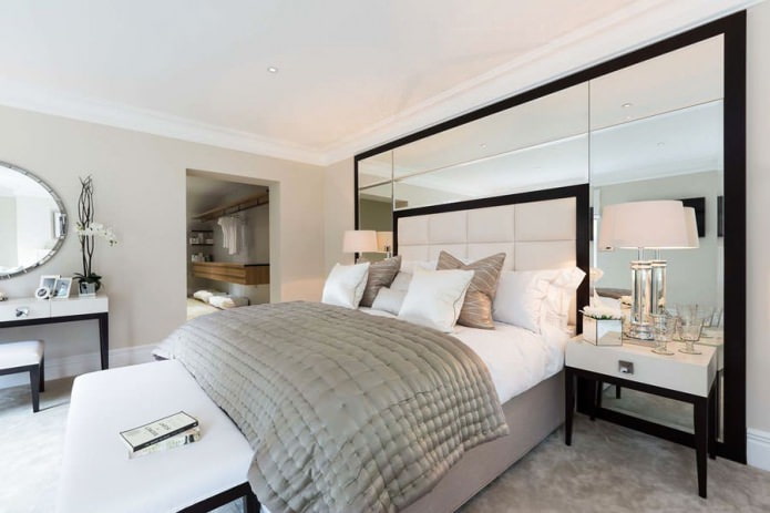 mirrored panels on the wall in the bedroom