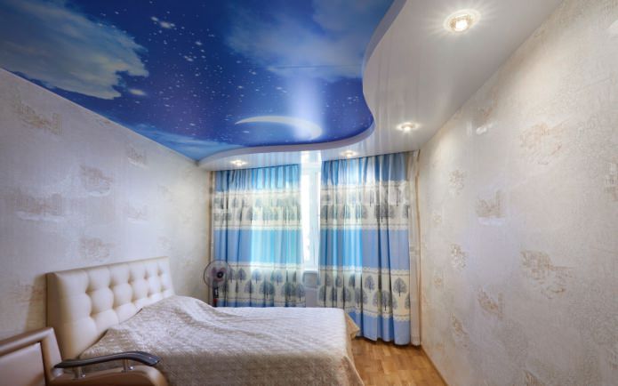 stretch ceiling with photo printing in the interior of the bedroom
