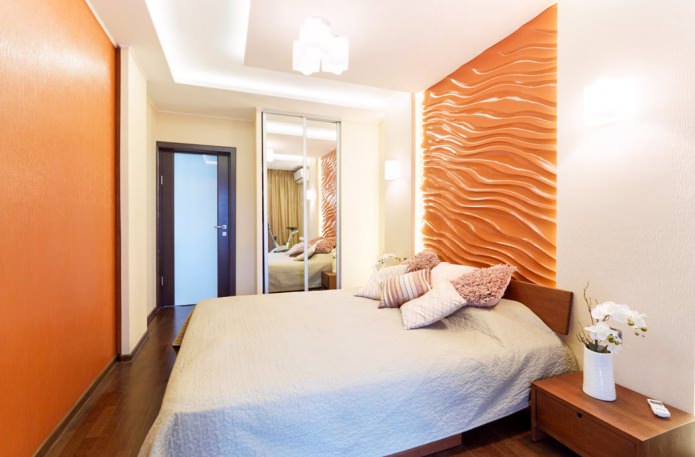 orangefarbene 3D-Paneele an der Wand im Schlafzimmer