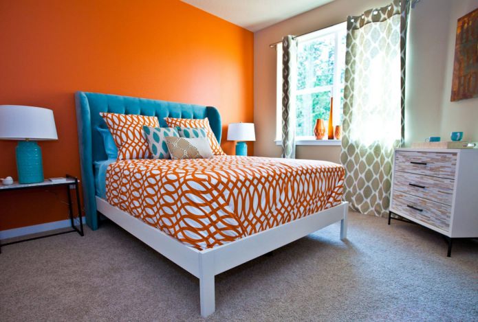 blue bed upholstery orange wall