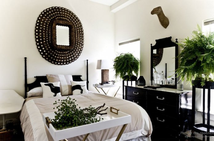 black and white bedroom interior with the addition of green