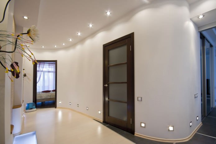 combination of light walls with a dark brown door with glass inserts