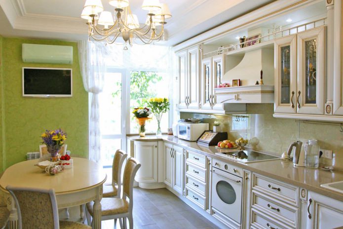 Green wallpaper in the interior of the kitchen in the style of a classic