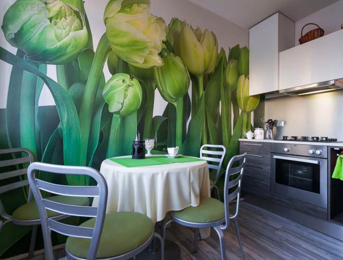 Green wallpaper with the image of tulips in the design of the kitchen