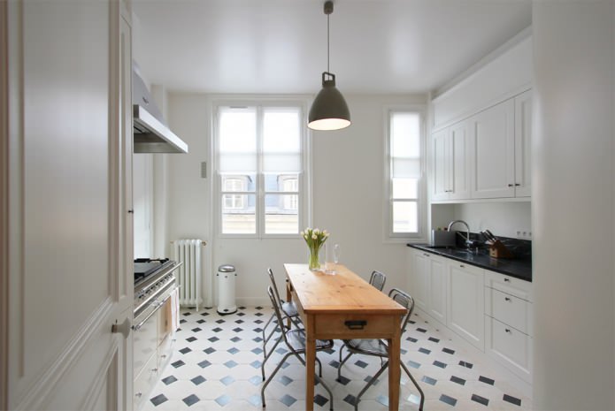 snow-white kitchen with black countertop