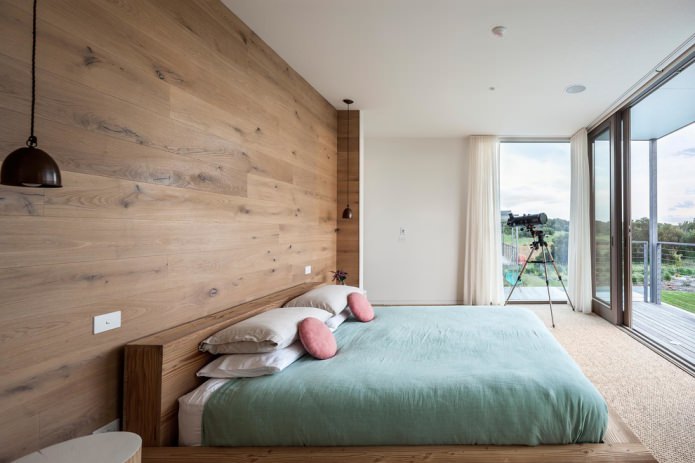 wood paneling on the wall in the bedroom