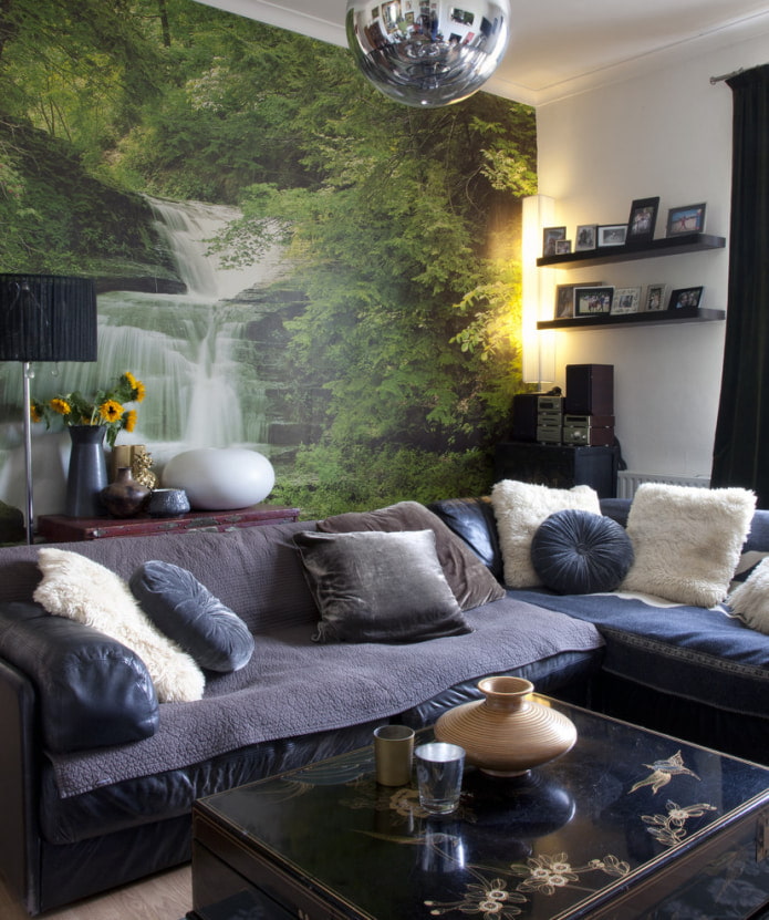 the image of a waterfall on the wallpaper above the sofa