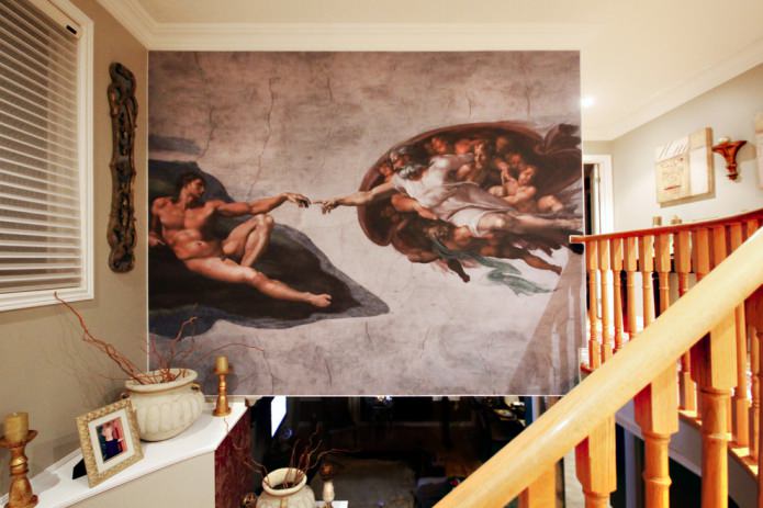 fresco with a reproduction of Michelangelo's painting The Creation of Adam