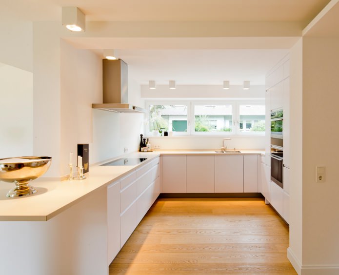 white kitchen interior with vanilla-colored worktop