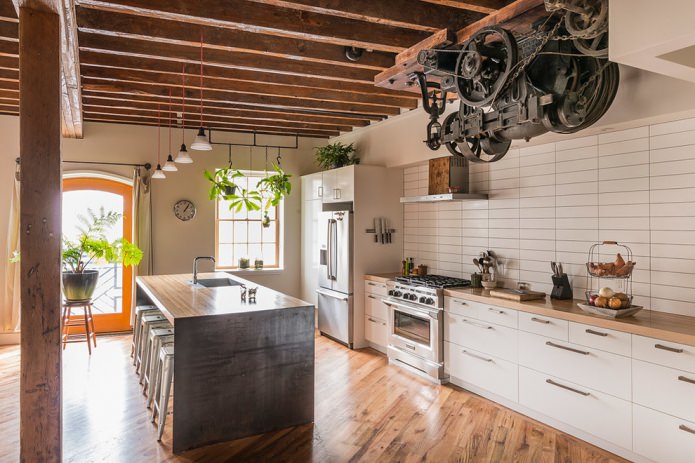 white loft-style kitchen with practical brick tiles