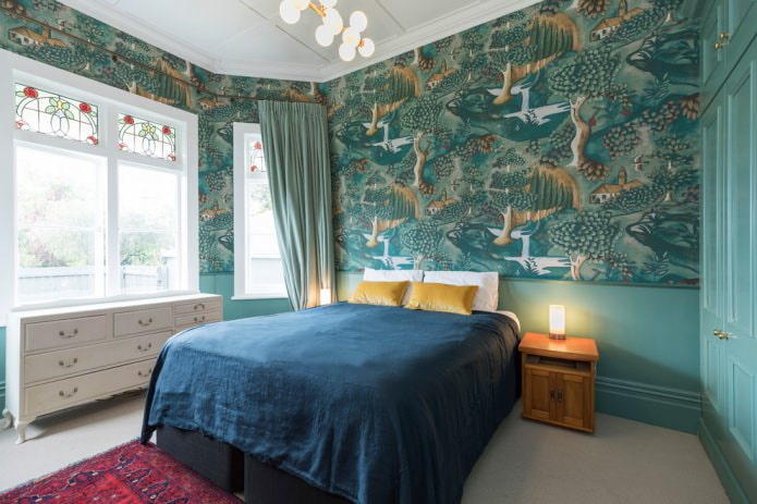 green wallpaper with a pattern in the bedroom