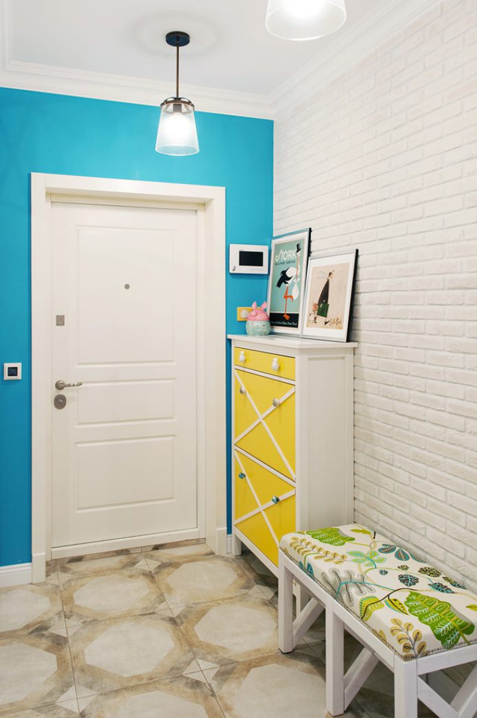 bright blue wall and brick wallpaper in the hallway