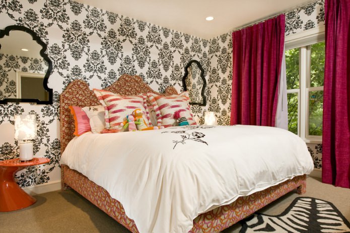 colored interior with bright pink curtains on the background of black and white wallpaper