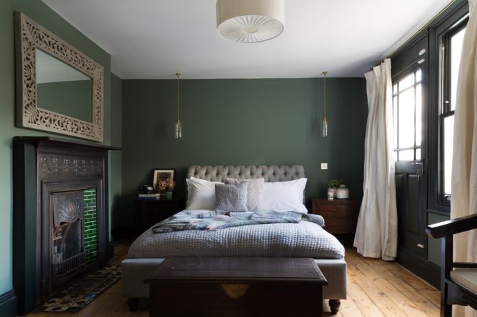 Green bedroom with light curtains