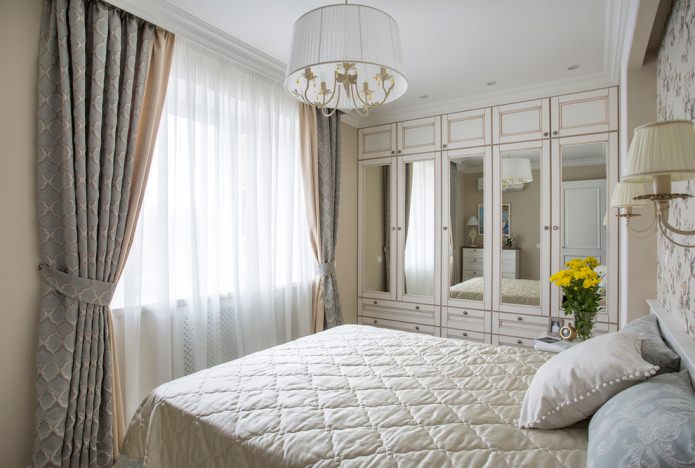 curtains and tulle are matched to the tone of a small bedroom