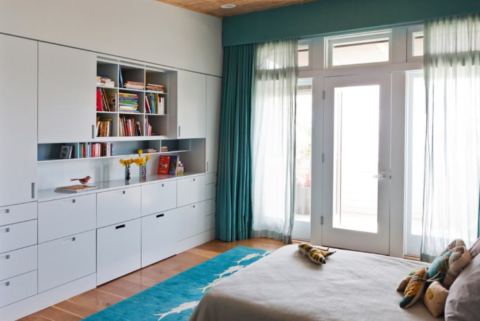 White interior with turquoise curtains