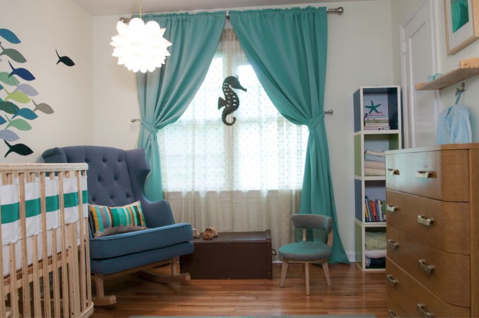 nursery with translucent tulle curtains and turquoise curtains