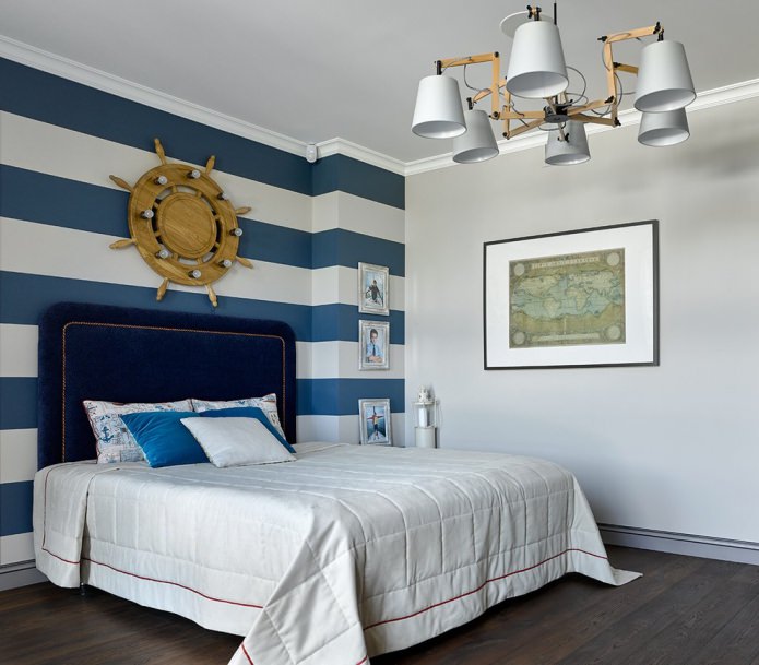nautical bedroom interior with striped wallpaper in white and blue
