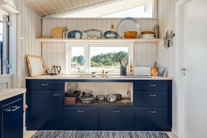 blue kitchen with planked walls