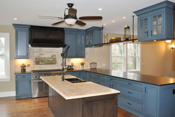 chipboard countertop in a white and blue kitchen