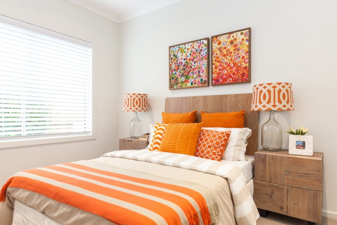 orange pillows in the bedroom