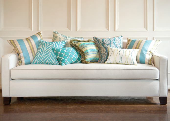 turquoise cushions on the sofa