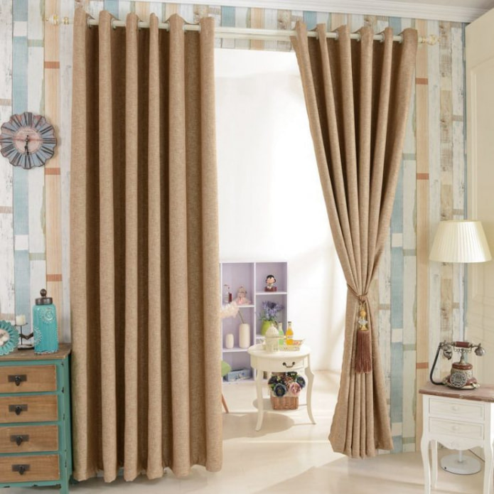 beige curtains on eyelets in the nursery