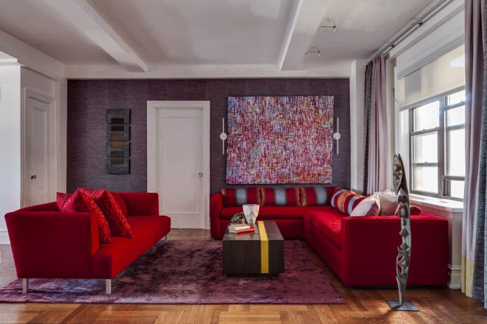 purple wallpaper and red fabric sofa