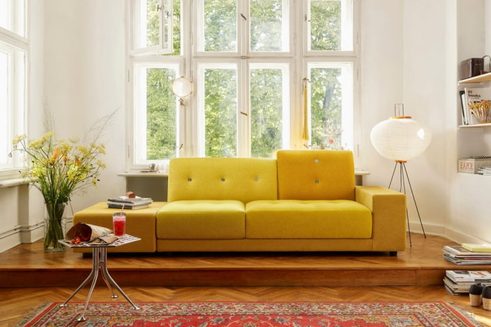 yellow sofa with fabric upholstery in the interior