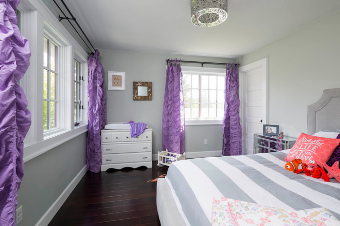 nursery with purple curtains