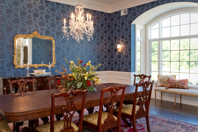dark blue wallpaper and brown furniture