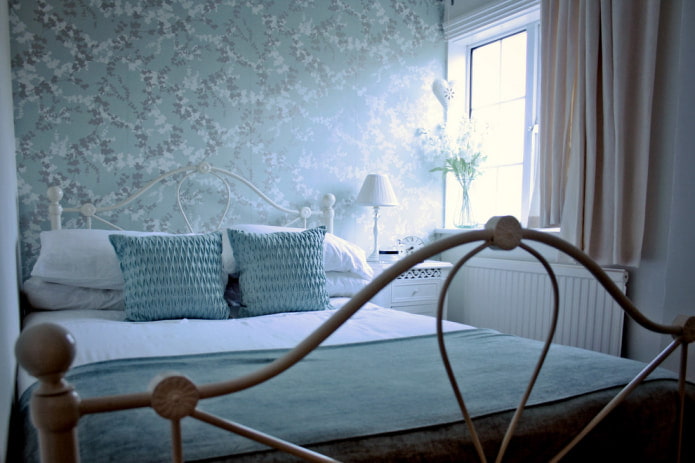 Light blue wallpaper with a floral pattern
