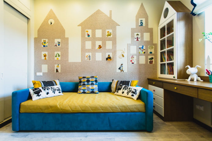 The wall is decorated with houses cut from self-adhesive wallpaper