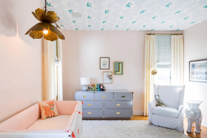 nursery interior with wallpaper on the ceiling