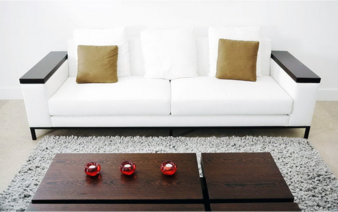 Sofa with wooden armrests