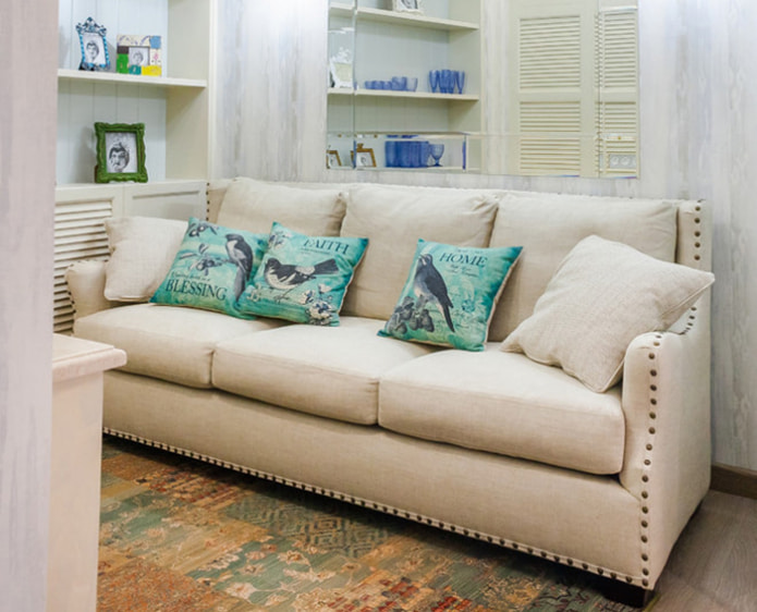 beige sofa with turquoise cushions