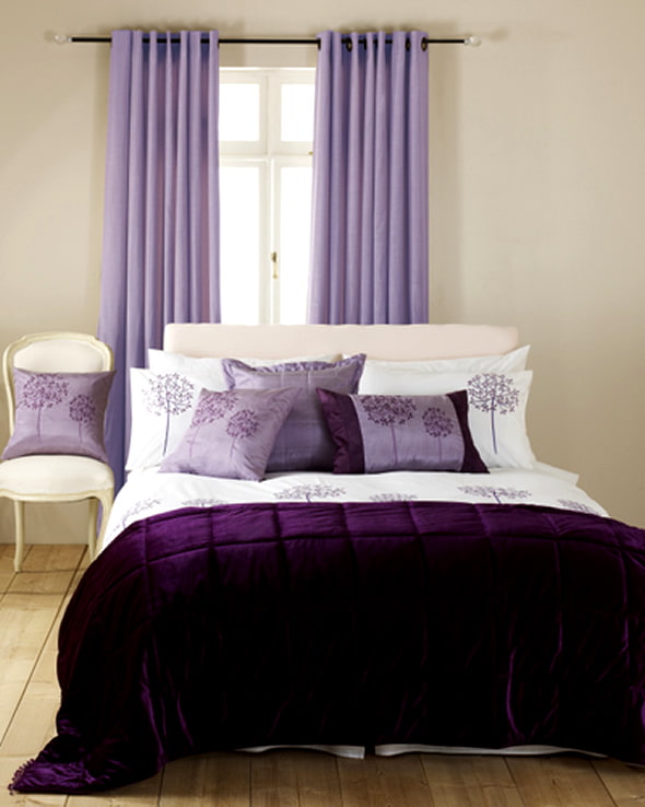 lilac curtains in the interior of the bedroom