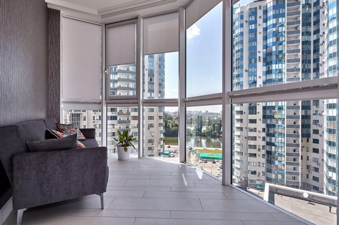 roller blinds on a glazed loggia with a panoramic view of the city