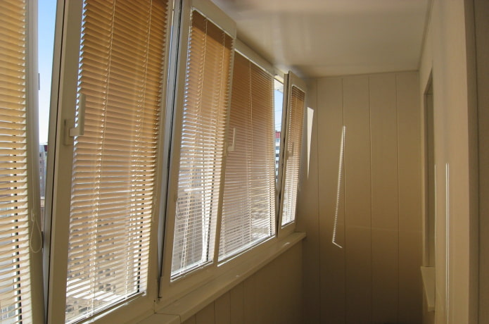 beige horizontal blinds on the loggia