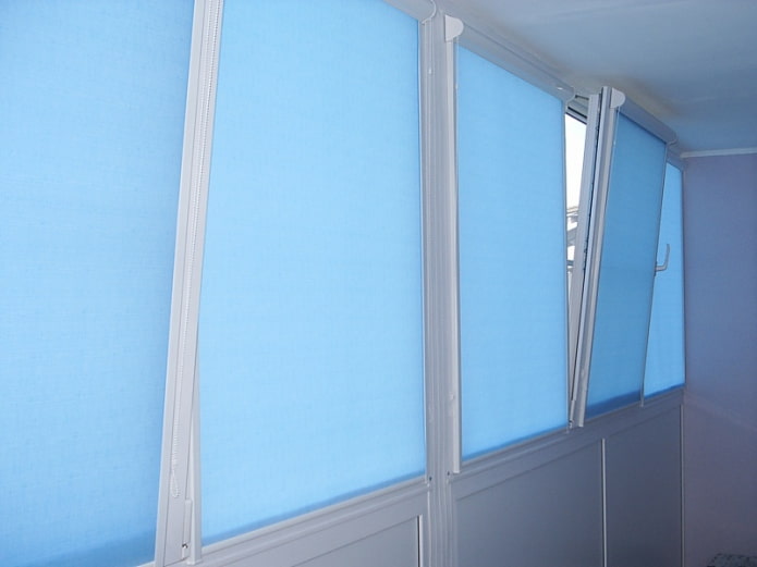 roller blinds made of mixed fabrics on the loggia