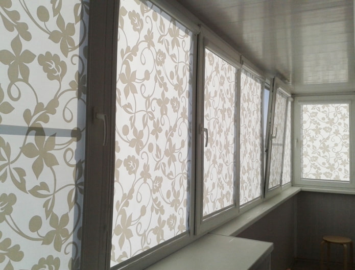 white roller blinds with a pattern on the loggia