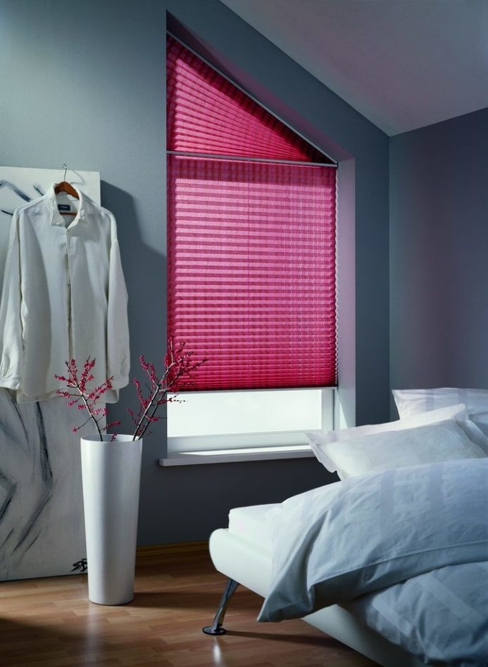 pleated blinds on slanting windows in the interior