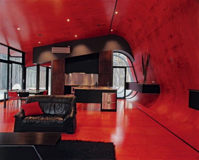 red walls and ceiling with black furniture