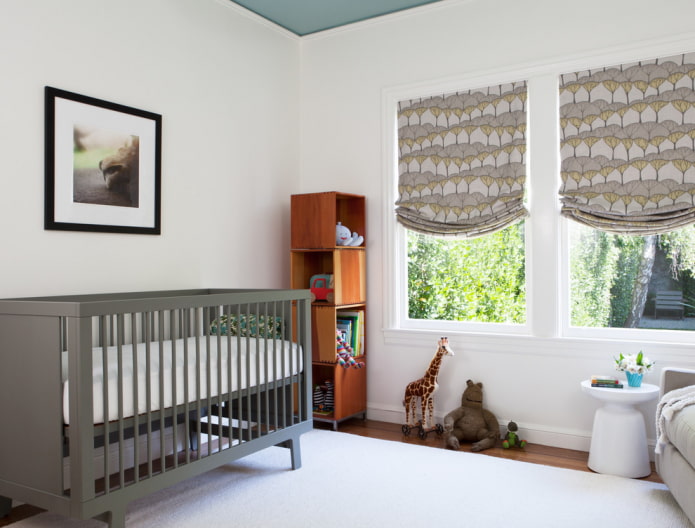 patterned roman curtains in the nursery