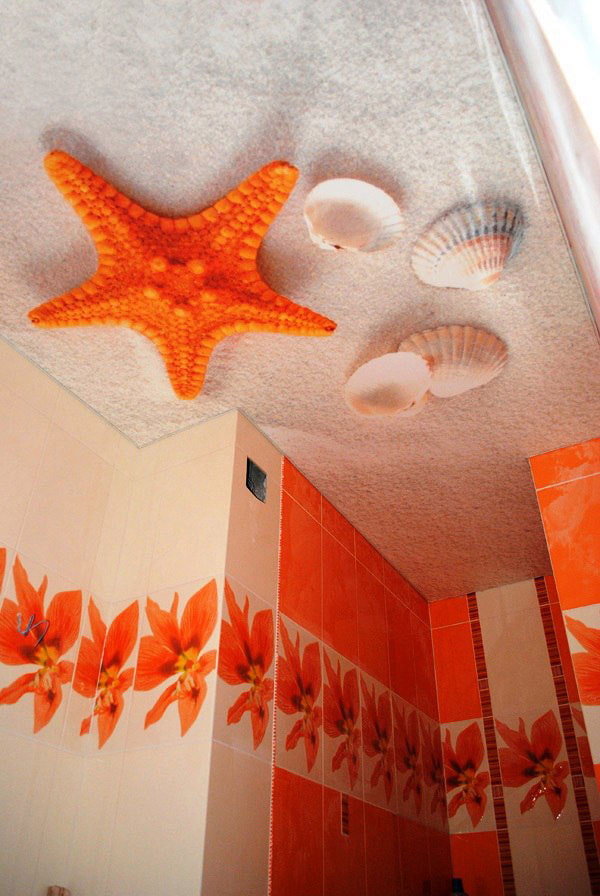 ceiling with a picture of the beach in the bathroom