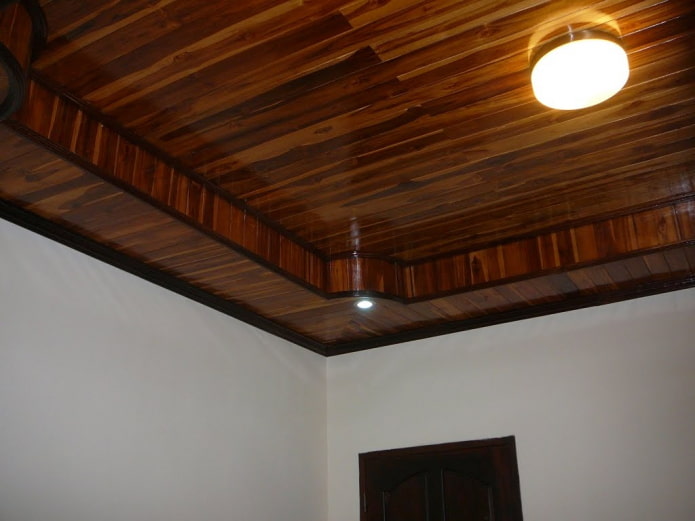 two-level ceiling structure sheathed with clapboard